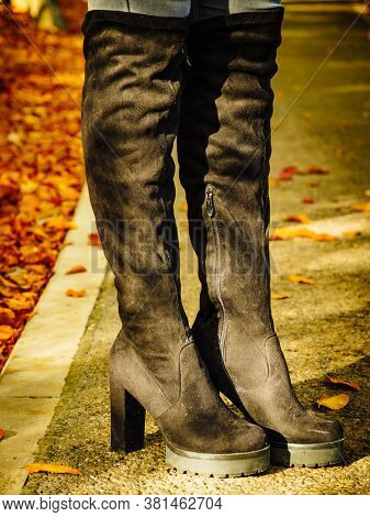 Woman Wearing Black Knee High Boots