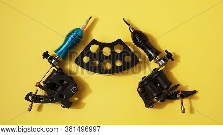 Tattoo Equipment, Tattoo Ink Plastic Stand For Tattoo Ink Caps And Tattoo Machines On Yellow Backgro