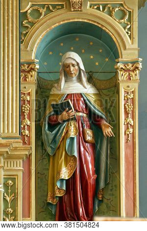 PESCENICA, CROATIA - SEPTEMBER 07, 2013: St. Anne, statue on the high altar in the parish church of the Assumption of the Virgin Mary in Pescenica, Croatia