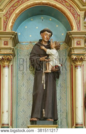 PESCENICA, CROATIA - SEPTEMBER 07, 2013: St. Anthony holds the baby Jesus, statue on the altar of St. Anthony of Padua in the parish church of the Assumption of the Virgin Mary in Pescenica, Croatia
