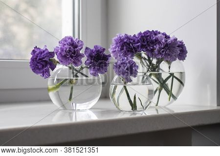 Bridal Bouquets Of Lilac Carnations In A Four Round Glass Vases Different Sizes As Table Decoration