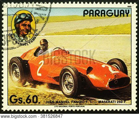 Moscow, Russia - August 18, 2020: Stamp Printed In Paraguay Shows Old Racing Car And Portrait Of Arg