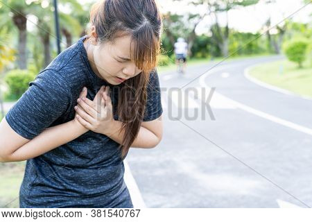 Exhausted Female Runner Suffering Painful Angina Pectoris Or Asthma Breathing Problems After Trainin