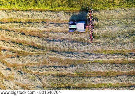 Top View Of Tractor With Tedders, Drying Mowed Hay