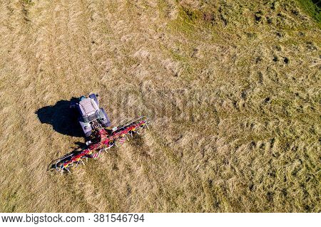Top View Of Tractor With Tedders, Drying Mowed Hay
