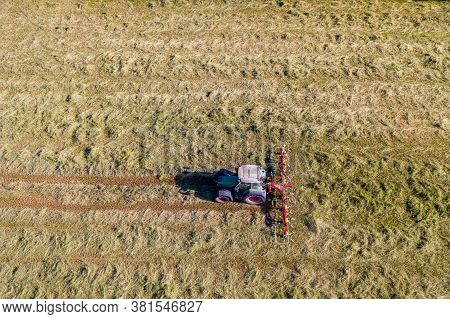Top View Of Tractor With Tedders, Drying Mowed Hay