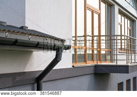 . Gutter System For A Metal Roof. Holder Gutter Drainage System On The Roof.
