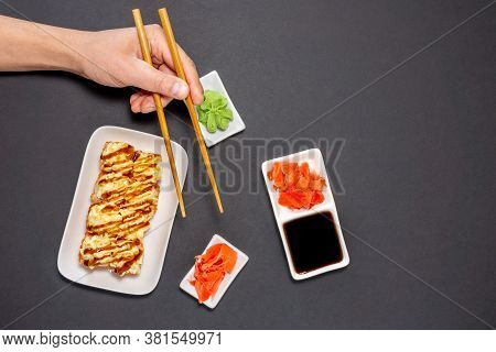 Sushi Rolly, Maki, Nigiri Set Server For Two On Black Stone On Dark Background. Top View Flat Lay