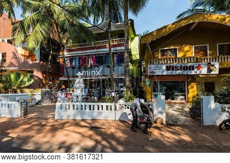 Candolim, North Goa, India - November 23, 2019: Street View Of Goa At Sunny Day With Parked Bikes Ne