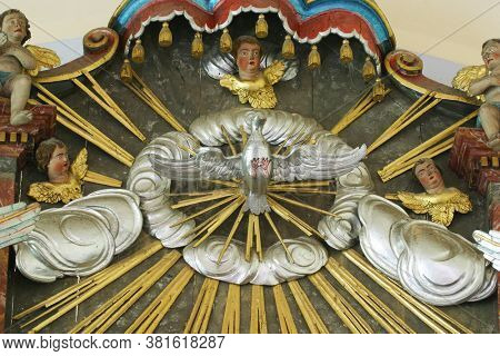 LOBOR, CROATIA - AUGUST 25, 2012: Holy Spirit Bird statue on the high altar at Saint Ana Parish Church in Lobor, Croatia