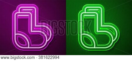 Glowing Neon Line Valenki Icon Isolated On Purple And Green Background. National Russian Winter Foot