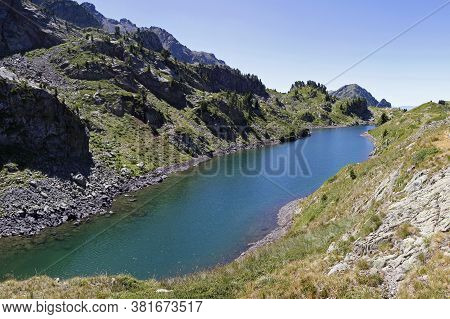 A Long Blue Lake In The Mountains