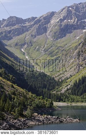 A Valley Runs Down Through The Forests To The Lake Shore