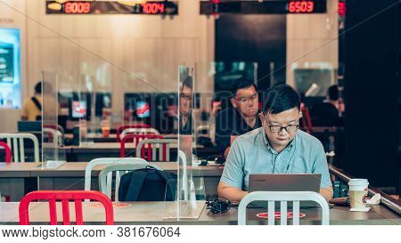 Bangkok-thailand, July 14, 2020: Unidentified Customers Work On Computer With Smartphone And Relax W
