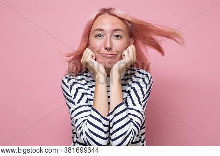 Caucasian Young Woman With Dyed Hair Looling At Camera And Smiling