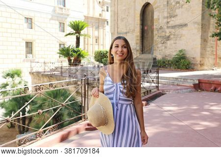 Beautiful Smiling Tourist Woman Visiting The Old Town Of Palermo In Sicily, Italy