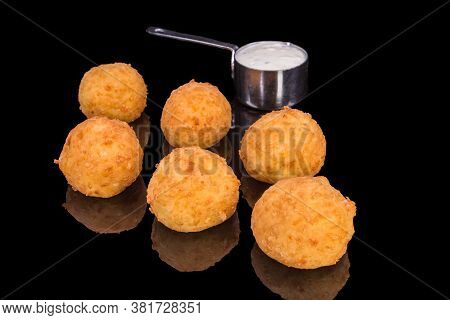 Delicious Balls From Yellow Cheese And Sauce With Reflection, Isolated On Black Background