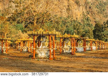 Golden Statues Of Buddhas In Lumbini Garden At The Base Of Mount Zwegabin Near Hpa-an In Myanmar, As