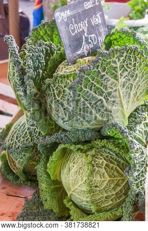 Cabbage For Sale At A Farmers Market. Head Of Cabbage. French Market.