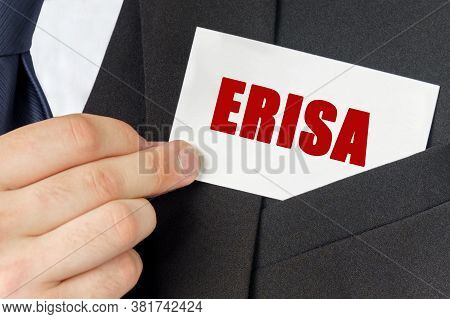 Business Concept. Businessman Holds A Card With The Text - Erisa