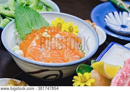 Salmon Sashimi With Salmon's Egg (ikura) In Bowl At Japanese Food Restaurant.
