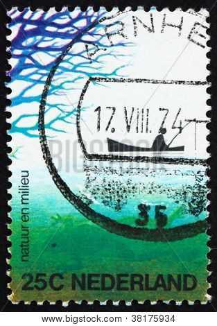 Postage stamp Netherlands 1974 Fisherman in Boat and Frog