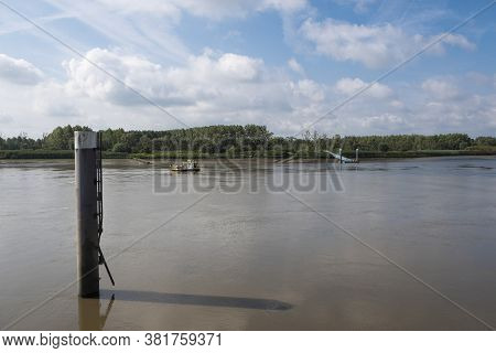 Tielrode, Belgium, 02 August 2020, Ferry Sails From Tielrode To Hamme On The Durme River