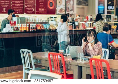 Bangkok-thailand, July 14, 2020: Unidentified Customers Work On Computer With Smartphone And Relax W