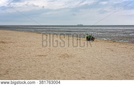 Strollers On The Beach At Schillig And The Wadden Sea