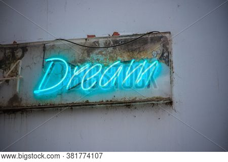 Blue Neon Sign Dream On A Grimy Wall Of London Street