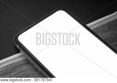 Mockup Blank Screen Mobile Phone On Medical Facemask On Working Desk Table For Coronaviurs Covid 19 