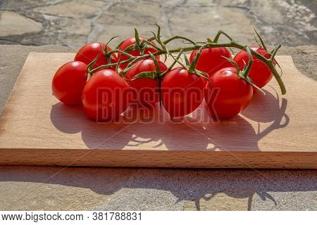 Fresh Cherry Tomatoes On The Wood. Top View. Close-up. Healthy Eating. Salad Ingredients