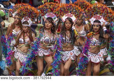 Oruro, Bolivia - February 25, 2017: Tobas Dancers In Colourful Costumes Performing At The Annual Oru