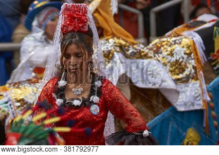 Oruro, Bolivia - February 25, 2017: Members Of A Waca Waca Dance Group In Ornate Costume Parade Thro