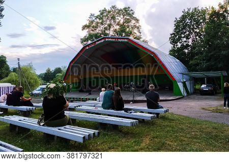 Belarus, Postavy - August 21, 2020: Few People On Benches In Front Of Open Air Scene