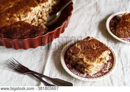 Apple And Cheese Cobbler Crisp. Cobbler Or Crumble Dessert With Apples In Ceramic Baking Form On Bei