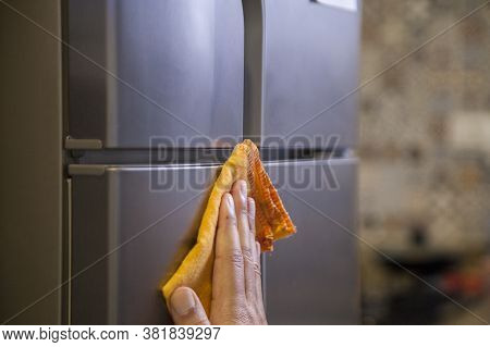 Cleaning The Refrigerator Against Coronavirus During Pandemic In Quarantine