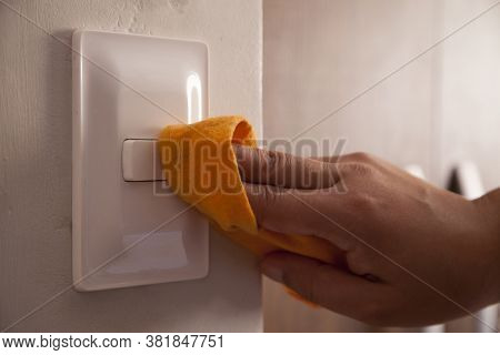 Cleaning The Room Light Switch Coronavirus Prevention