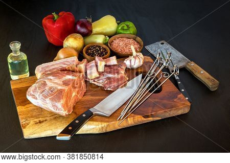 Raw Neck Of Pork On A Cutting Board. Preparing For Summer Barbecue. Raw Meat. Pork Neck Meat On Wood