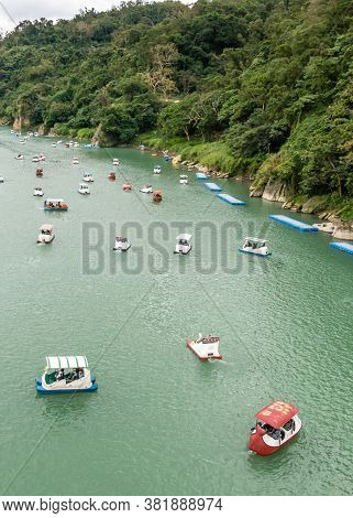 Unidentified People Enjoying Pedal Boats At Bitan Scenic Area