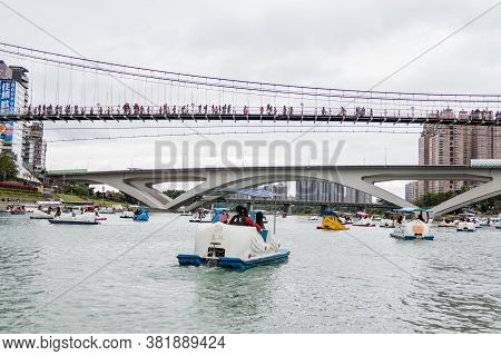 Unidentified People Enjoying Pedal Boats At Bitan Scenic Area