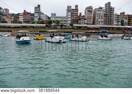 Unidentified People Enjoying Pedal Boats At Bitan Scenic Area