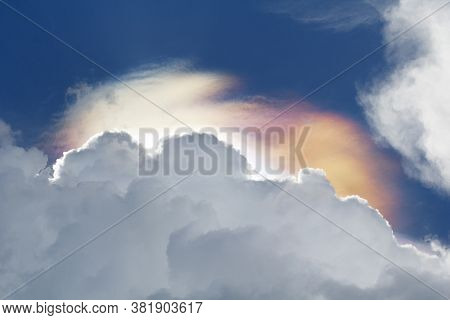 Iridescent Clouds Phenomenon On Before Rain On Sky