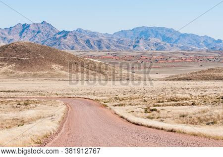 Road And Mountain Landscape On Road C27 In The Namibrand Area