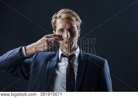 Businessman Draws Two Stripes On His Cheeks, War Paint. Competition In Business, Concept. A Young Ma