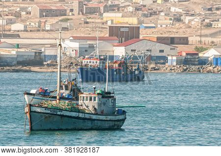 Luderitz, Namibia - June 15, 2011: A View Of Boats With Luderitz In The Back As Seen From Shark Isla