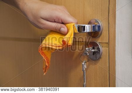 Cleaning The Door Handle For Coronavirus Prevention During Normal New Quarantine