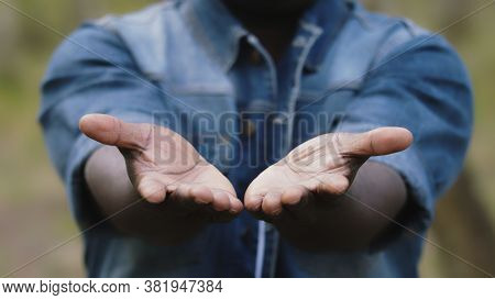 Close Up. African Man Putting The Open Palms Together. High Quality Photo