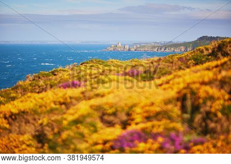 Scenic View Of Cape Frehel And Its Lighthouse, One Of The Most Popular Tourist Destinations In Britt