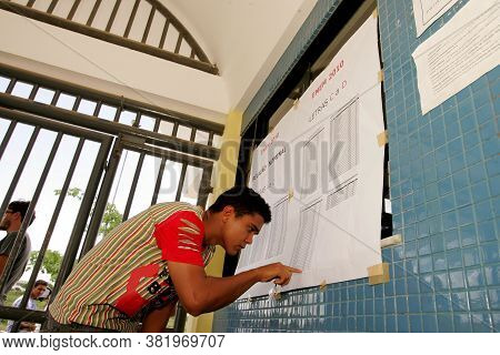 Eunapolis, Bahia / Brazil - November 6, 2010: People Look At Attendance List For Exams Of The Nation